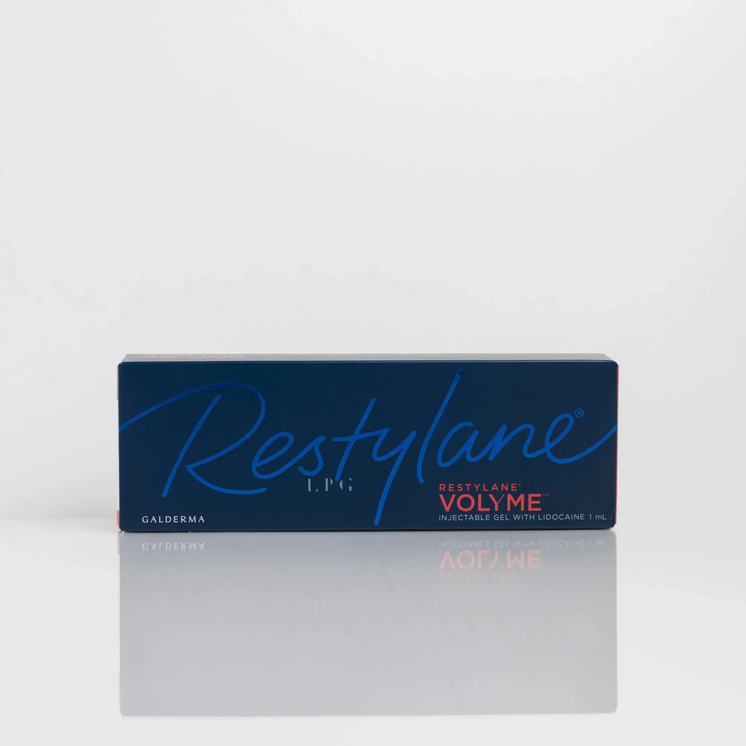 Blue box labeled "Restylane Volyme" with white and red text on a reflective surface.